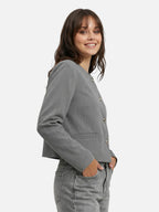 Gray collarless buttoned women's blazer with short elegant cut