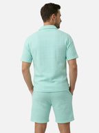Conjunto de polo y pantalones cortos texturizados de manga corta para hombre