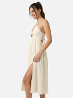 Robe midi halter écrue dos nu à découpes et fente latérale