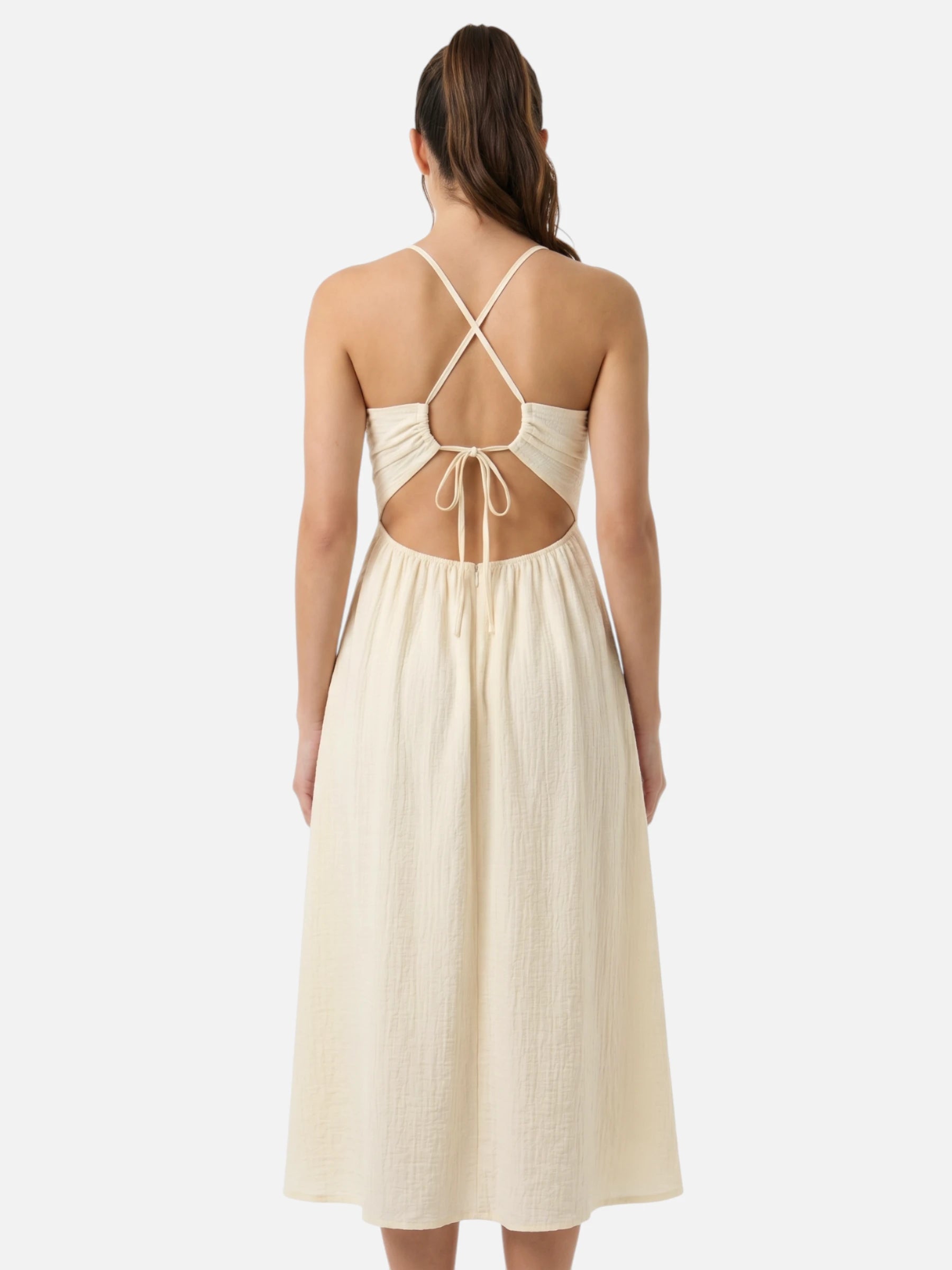 Cream halter midi dress with open back, cutouts, and side slit